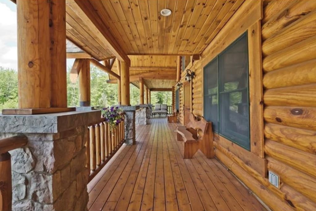 Front Porch with swinging chair, benches, and lounger