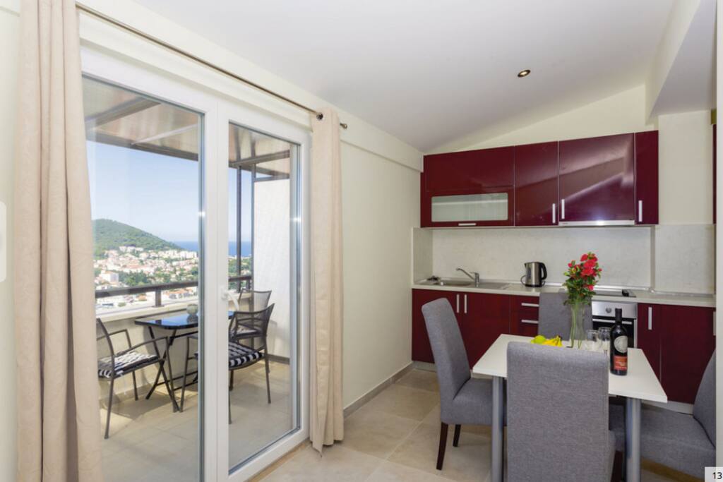 Kitchen & dining area with balcony access