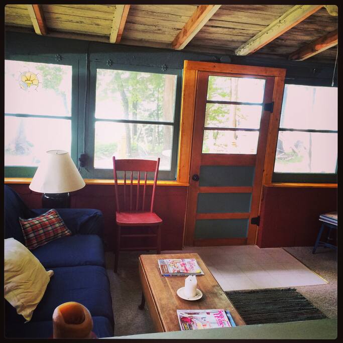 Living Room/Sleeping porch - door to deck.