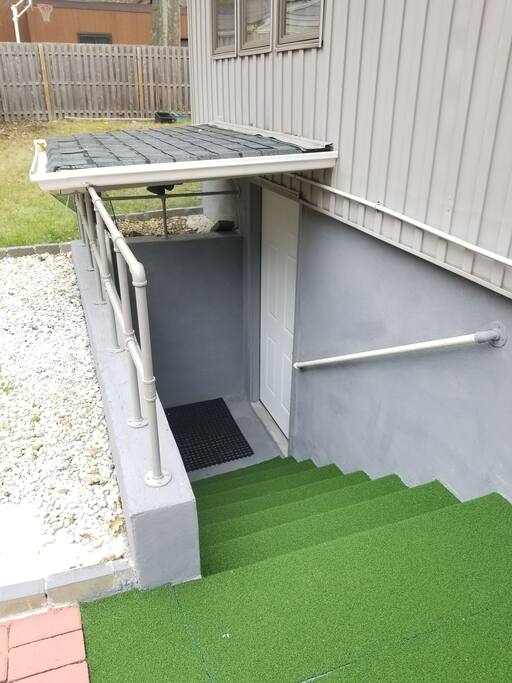 Stairs to entry door. Door has numerical keypad lock. No keys to worry about!