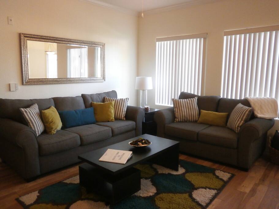 Over sized couch and love seat with additional pillows