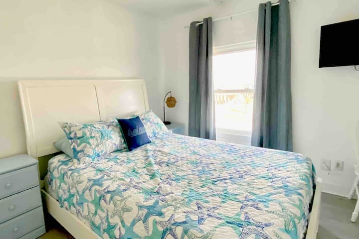 Upstairs Queen bedroom with TV
