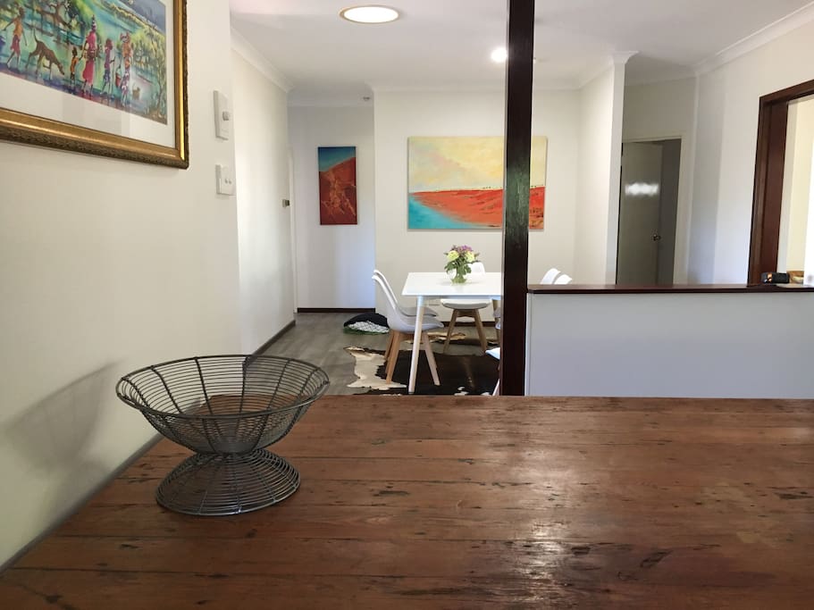 Choose to sit around the fabulous "shabby chic" kitchen bench or the modern stylish white dining room table as you enjoy your meals.