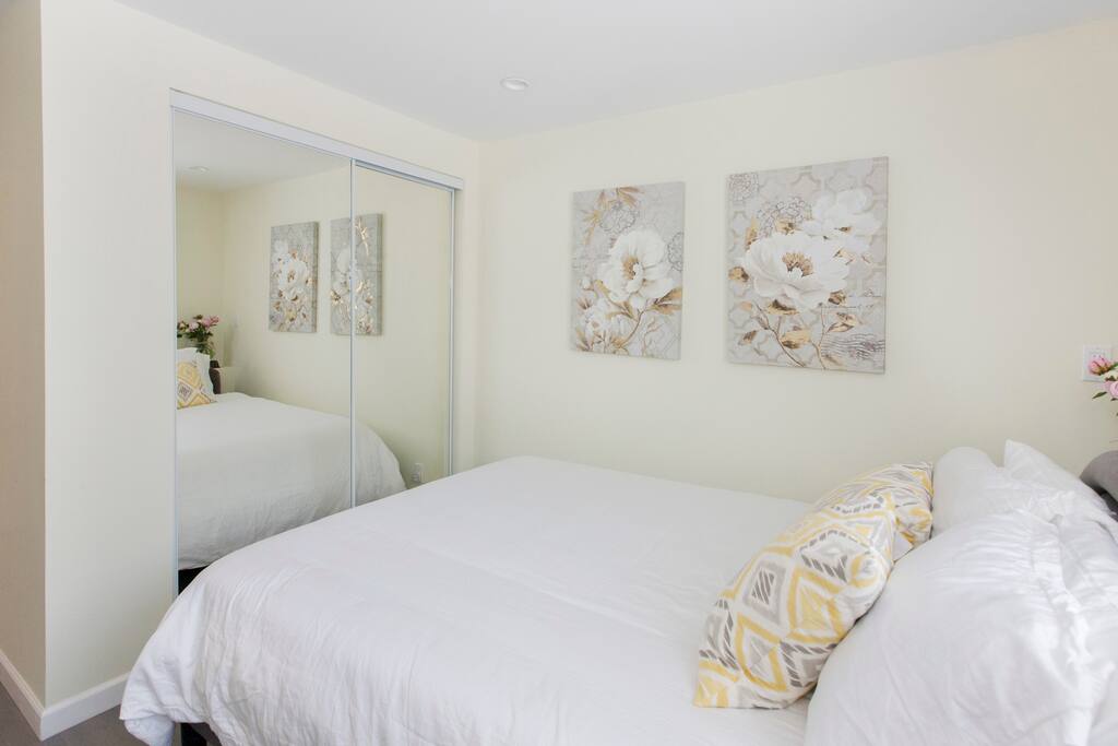 Closet space and mirrors. Inside the closet we provide hangers, a luggage rack, iron and ironing board, and extra blankets.