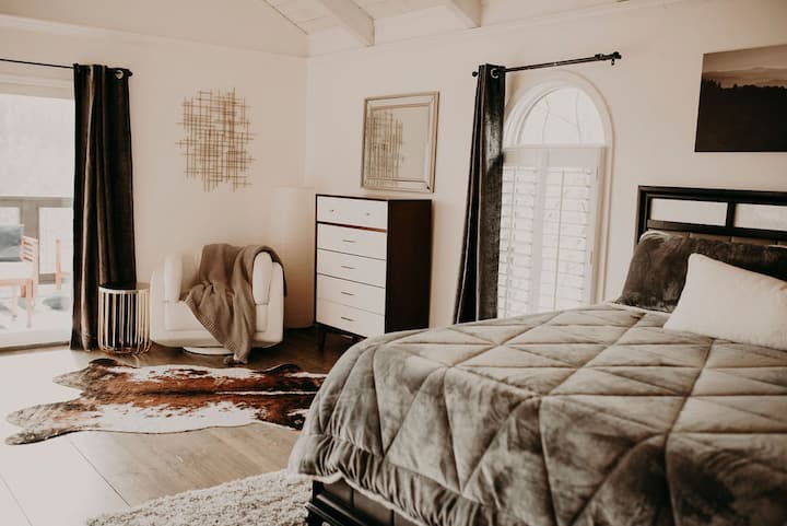 The master suite makes this the best stay in the Smokies. Ugg bedding and pillows and a view of the Smokies from your private balcony. Enjoy a movie from the living room inside the master suite.