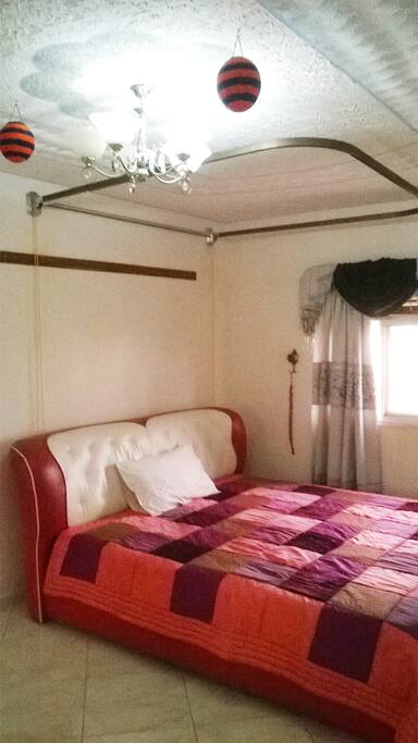Queen bed with mosquito net