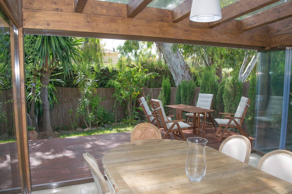 The pergola is a beautiful place to relax with your morning coffee or evening meal
