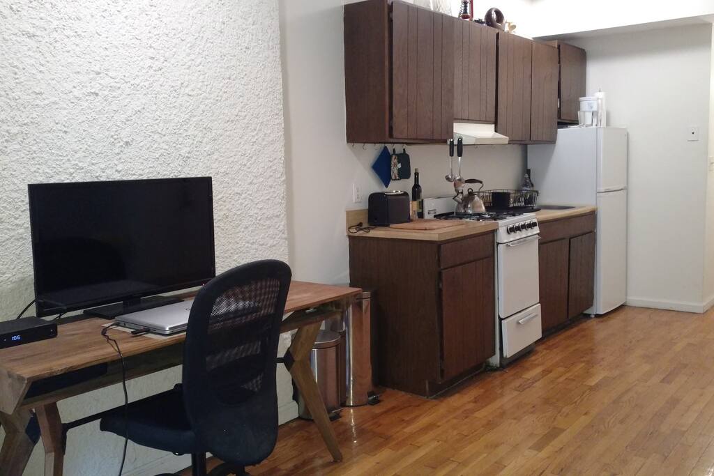 desk and kitchen area