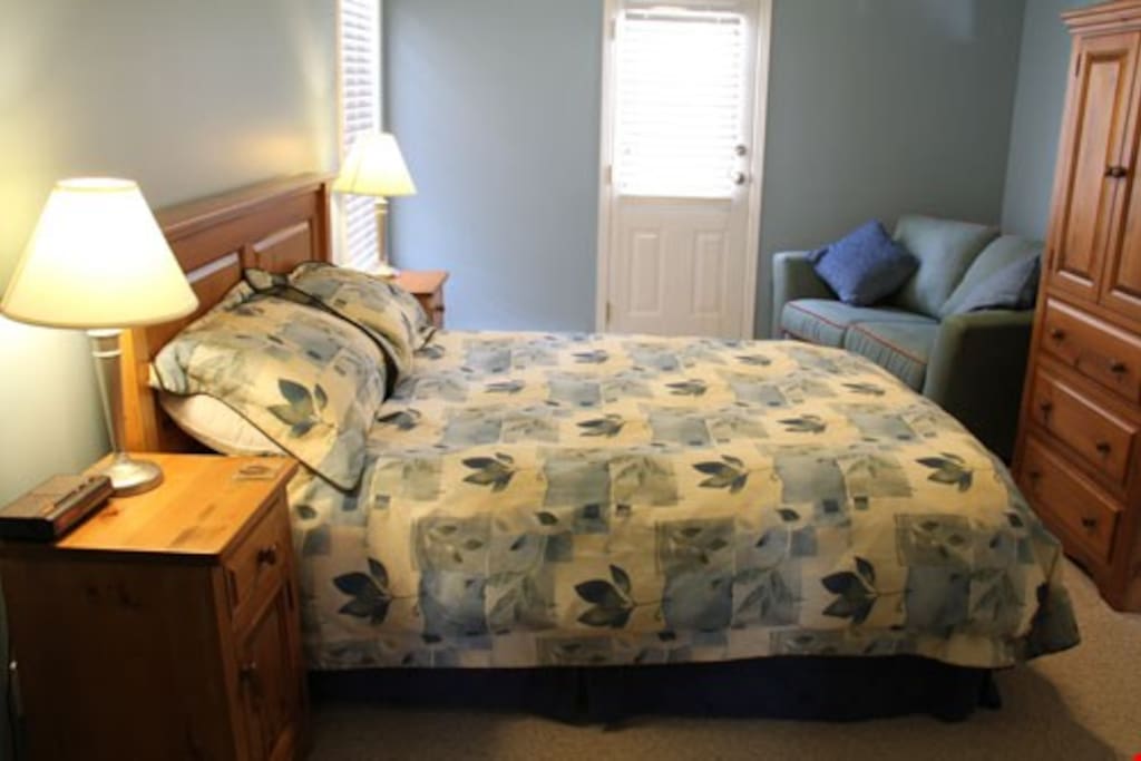 The master bedroom features a plush queen bed and ample cupboard space for your belongings.