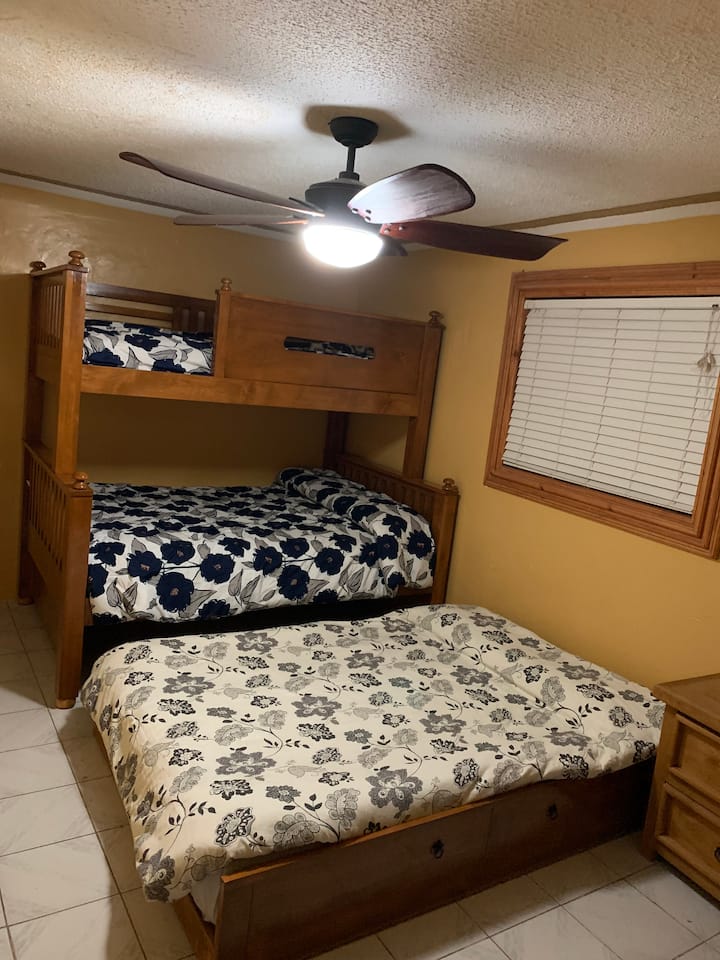 Bunk bed with pull-out trundle.