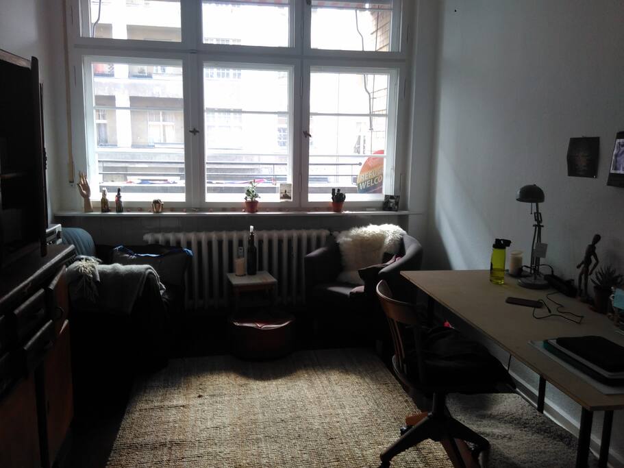 two armchairs and the balcony behind the window