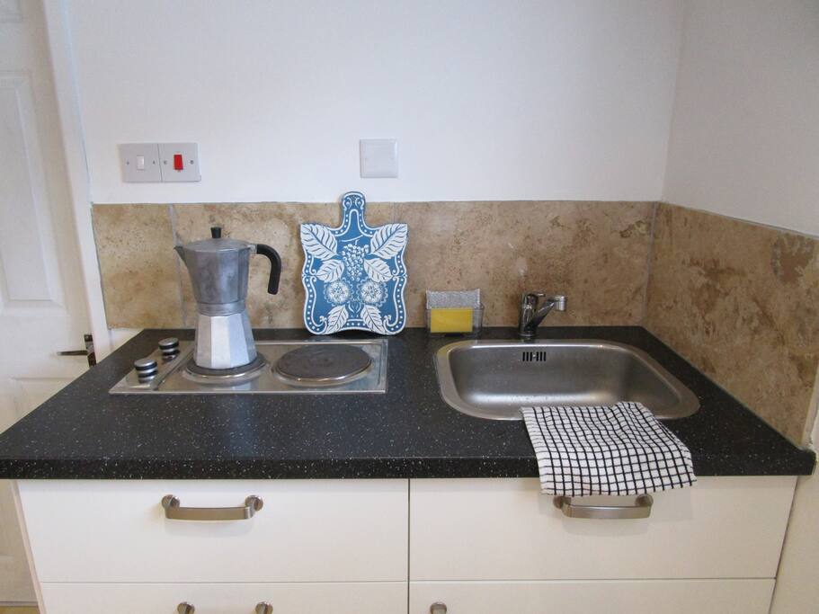 Kitchenette with electric hob and sink
