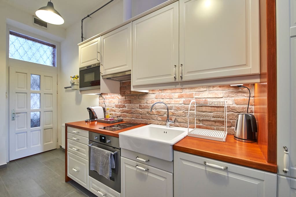 Kitchen is fully equipped for cooking.