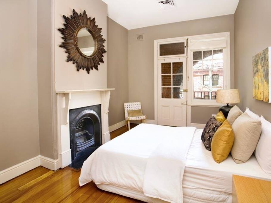 Main bedroom with queen bedding, opening up to the main balcony (please note there will be some new furnishings -new photos to come)