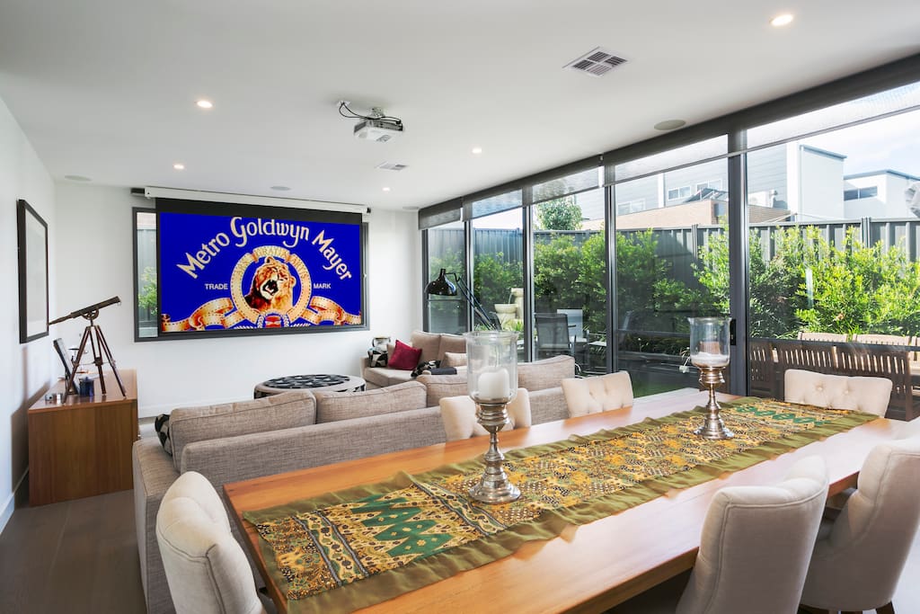 Combined dining /lounge with projection screen and tv