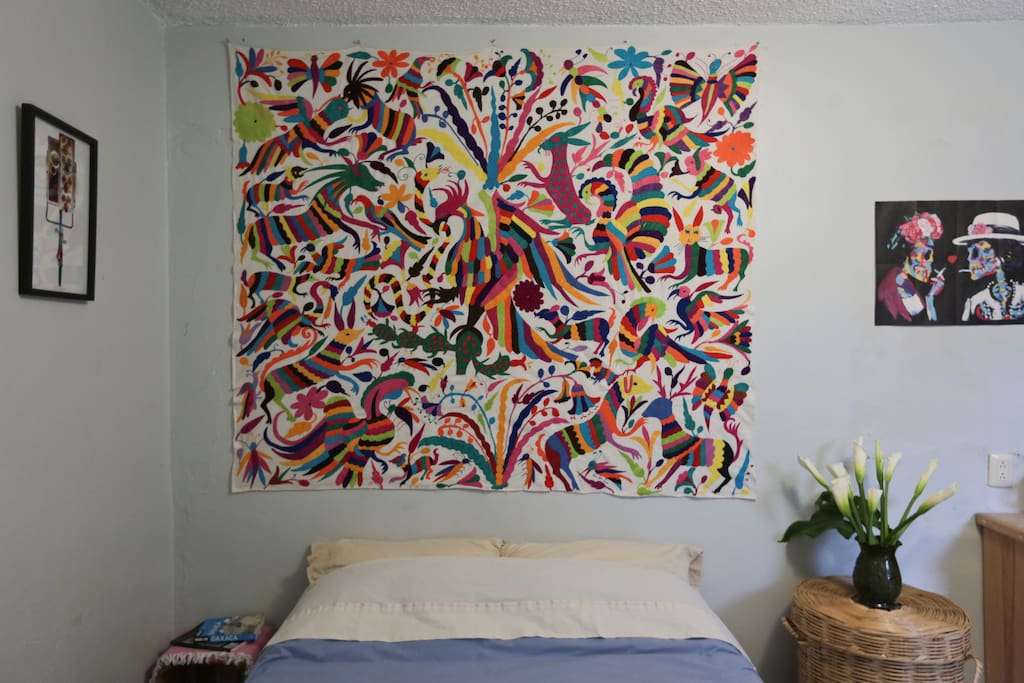 Our home is loving decorated with original artwork, local handicrafts and lots of plants! Sleeping under this incredible Otomi embroidery promises great dreams!