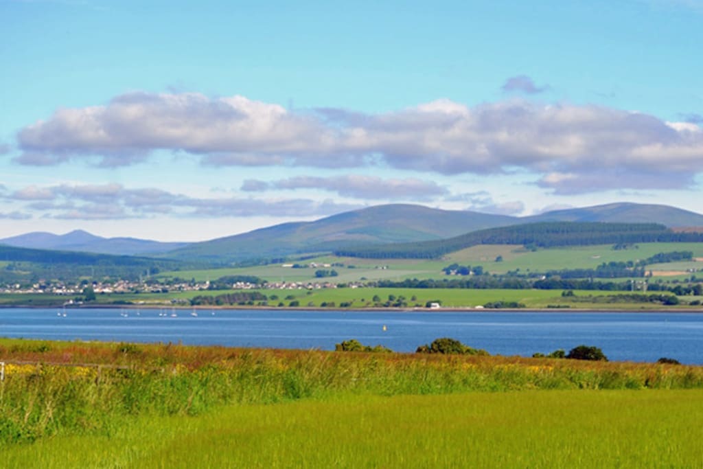 These elevated views from the house extend over barley fields, the Cromarty Firth to the hills beyond