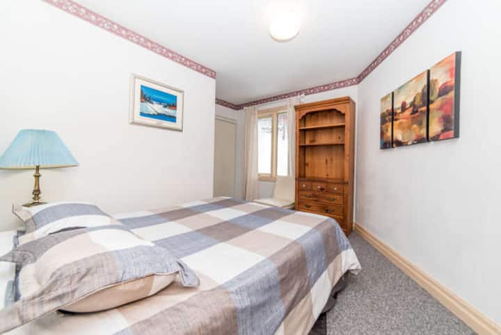 The fifth bedroom upstairs also includes a queen size bed and has a window overlooking the ski hill.