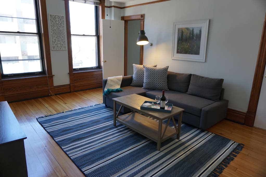 The pull out sofa sleeps 2 & has storage in the "L" part of the sofa for all your pillows & blankets!
