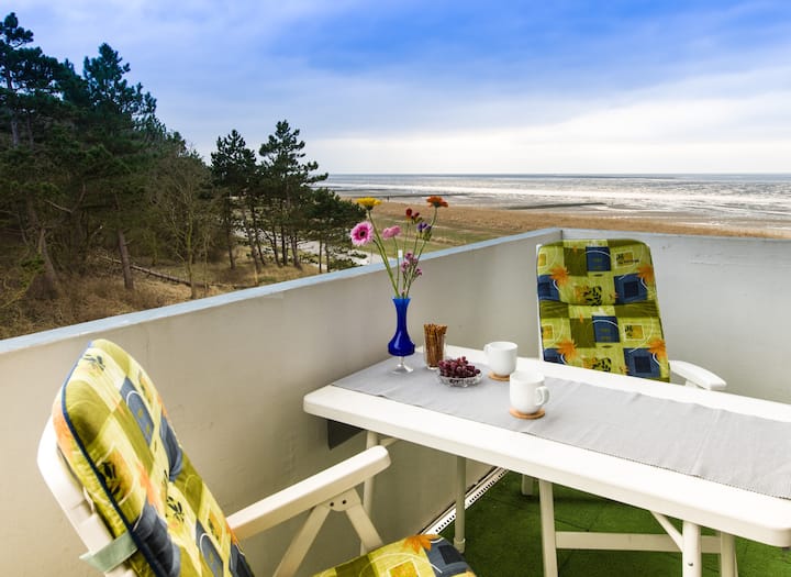 Seaside flat with a roofed beach chair