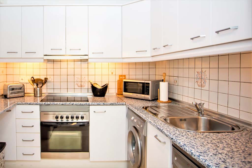 An excellently resourced kitchen, with cooker, microwave, hob, washer, dishwasher and fridge/freezer!