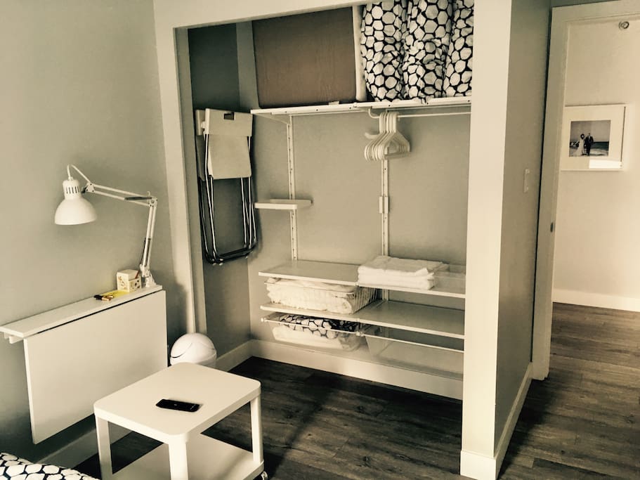 Functional storage includes fold down desk with lighting