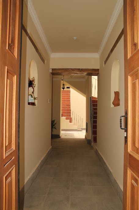 Through front doors into central courtyard