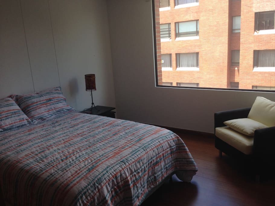 Comfortable Master bedroom with TV, great natural light and private bathroom.