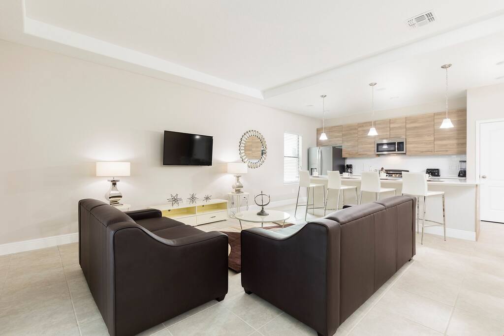 Relax in the cozy living room and catch a movie on the wall-mounted flatscreen TV.