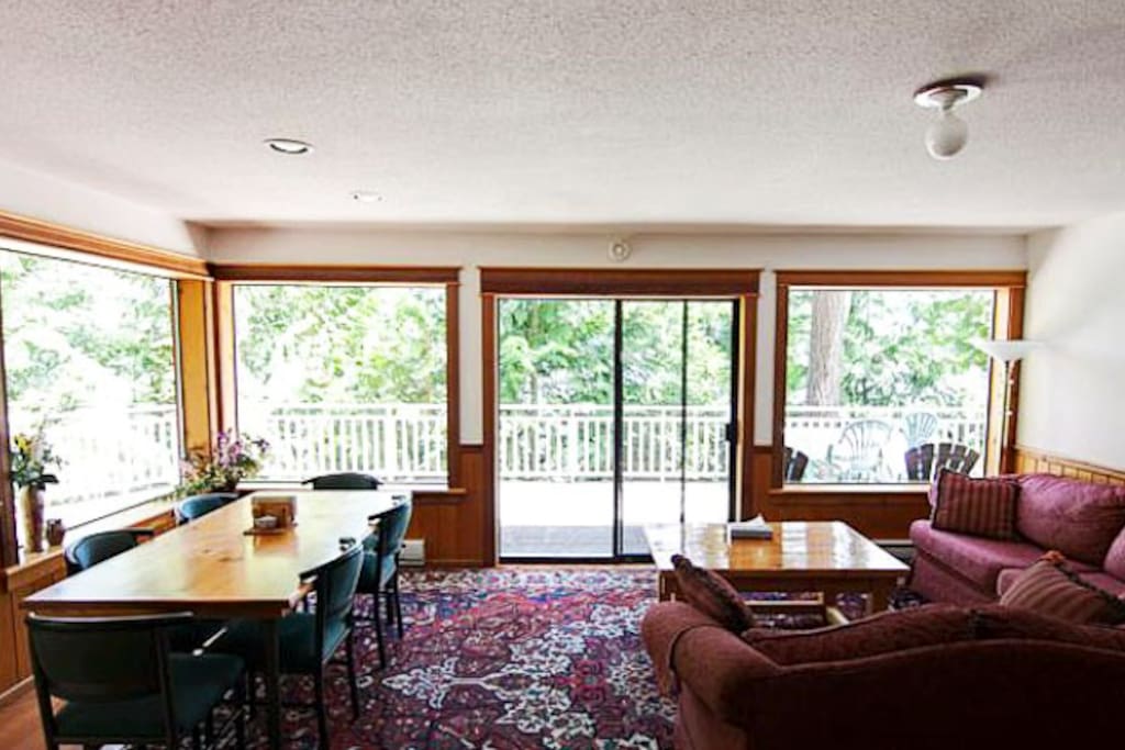 The living area features an open floor plan and cozy furnishings