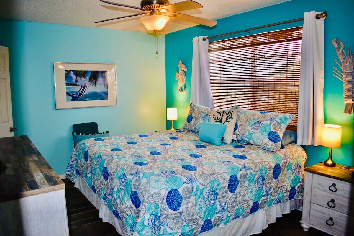 Bedroom 1 in Unit #3 with King size bed, blackout curtains and smart TV