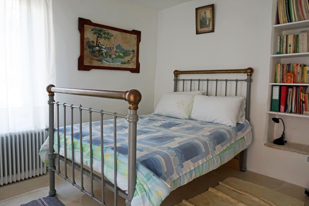 The spacious bedroom offers a double bed as well as a fitted bookcase.