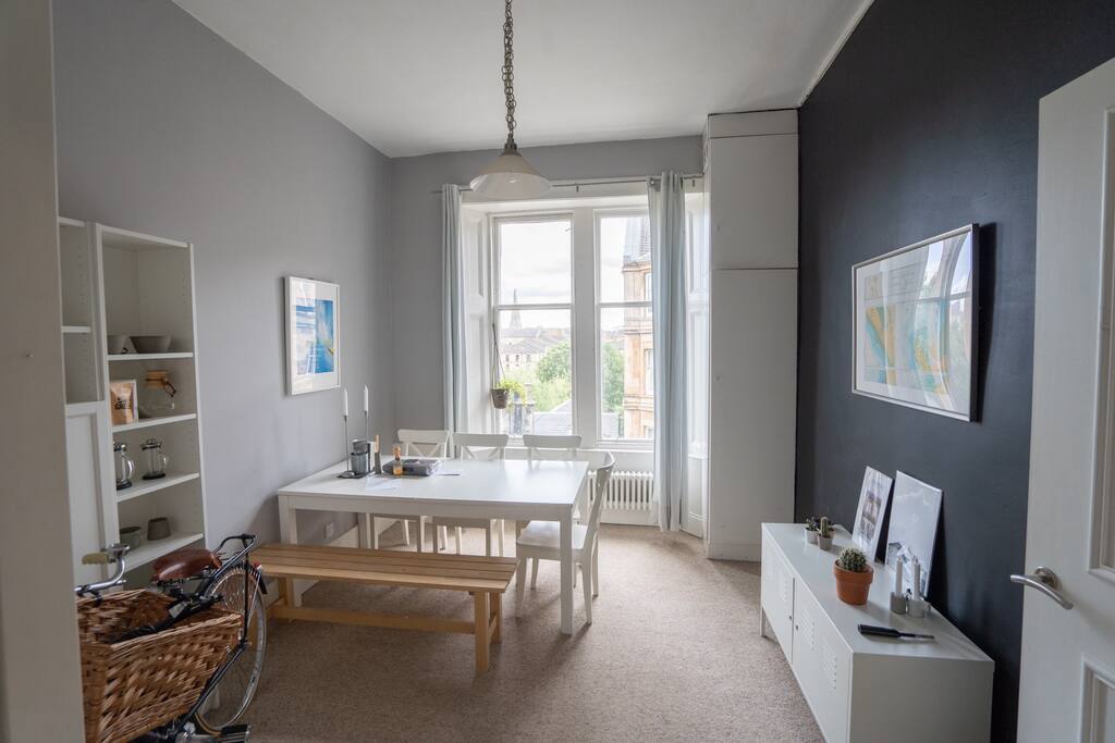 Kitchen and dining room with a table large enough for 4 people.