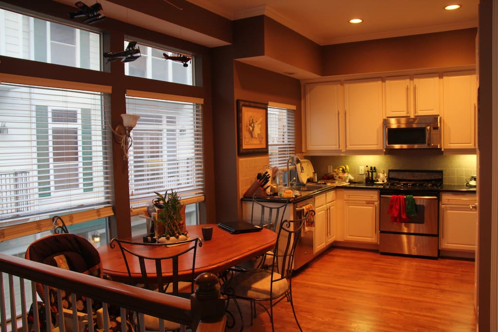 Kitchen/dining area with stainless steel appliances.