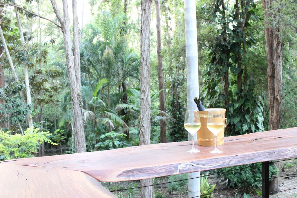 Unwind on the deck at the natural timber bar and enjoy nature surround you