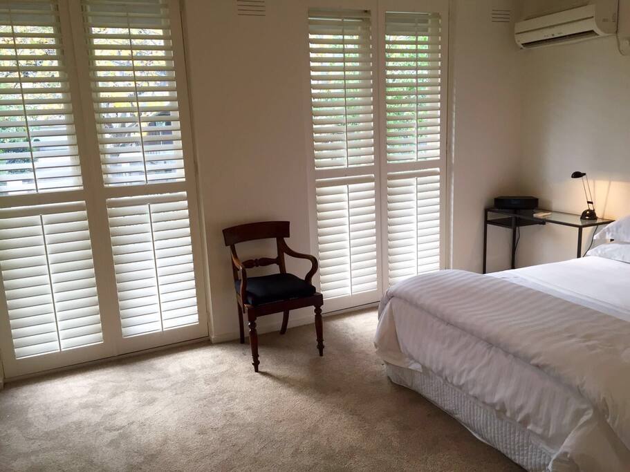 Large glass doors with access to private front terrace