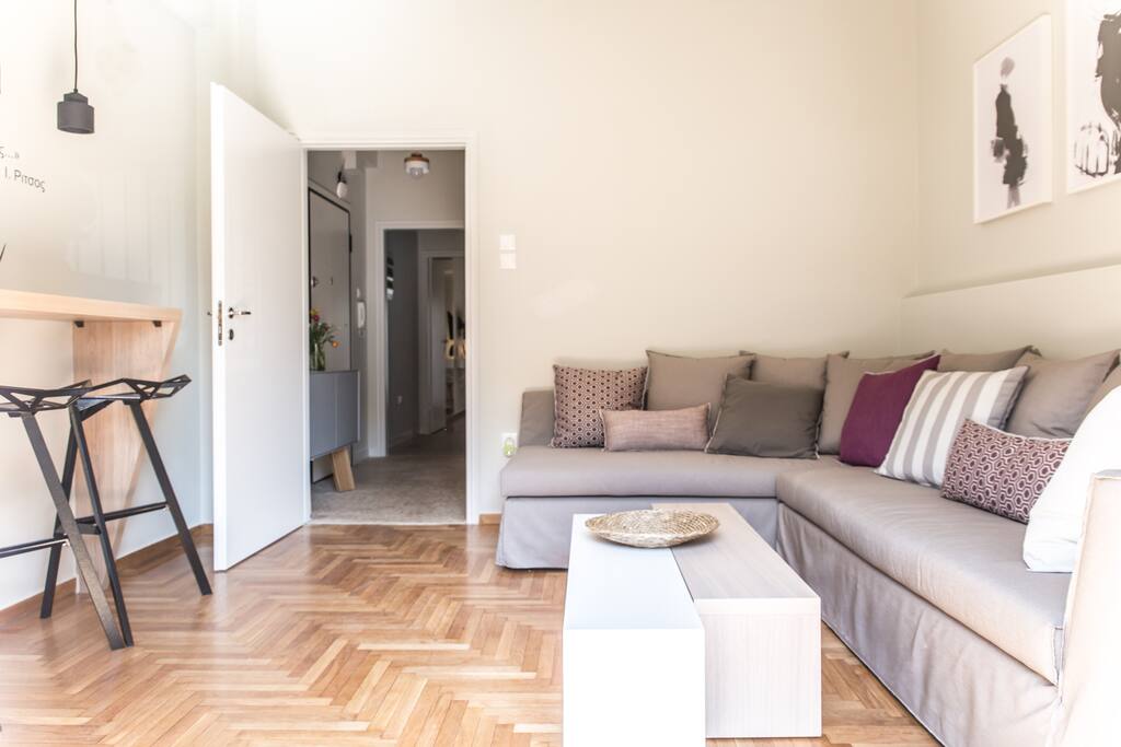 Well lite and modern Living Room with stereo and smart TV with Netflix channels