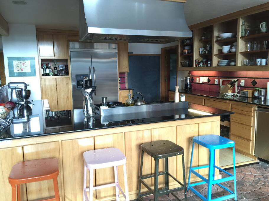 Kitchen with large gas range stove.