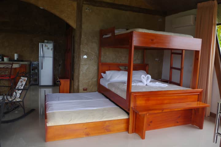 The studio apartment features a bunk bed and a pull out bed, sitting area, Smart TVC with Roku and AC