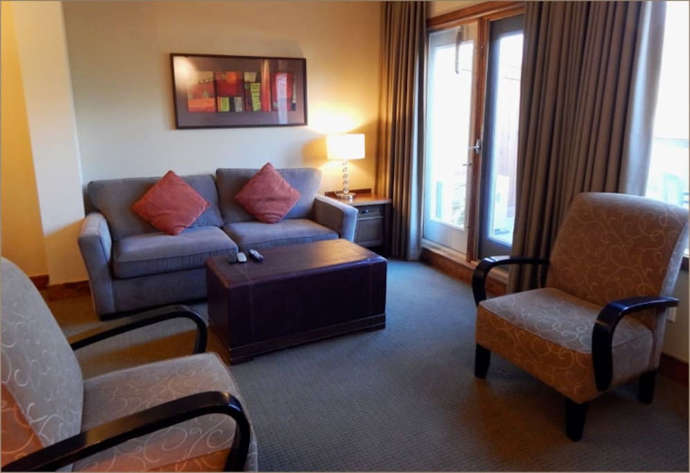Spacious open plan living area with pull out double sofa bed