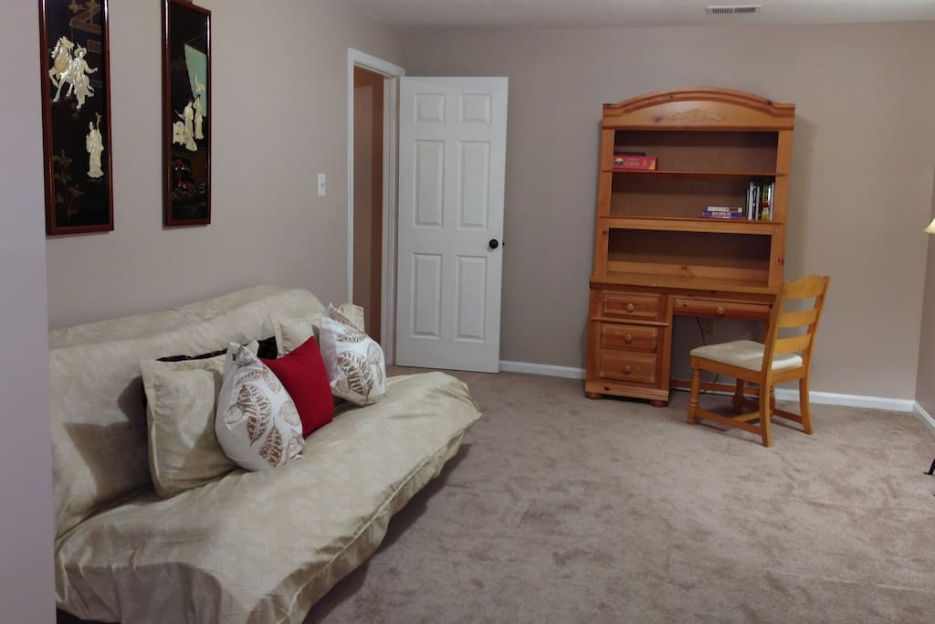 Queen futon in separate area adjacent to Living Room