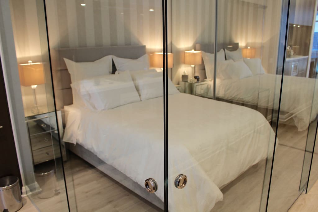 Super comfy Queen Bed with glass privacy walls