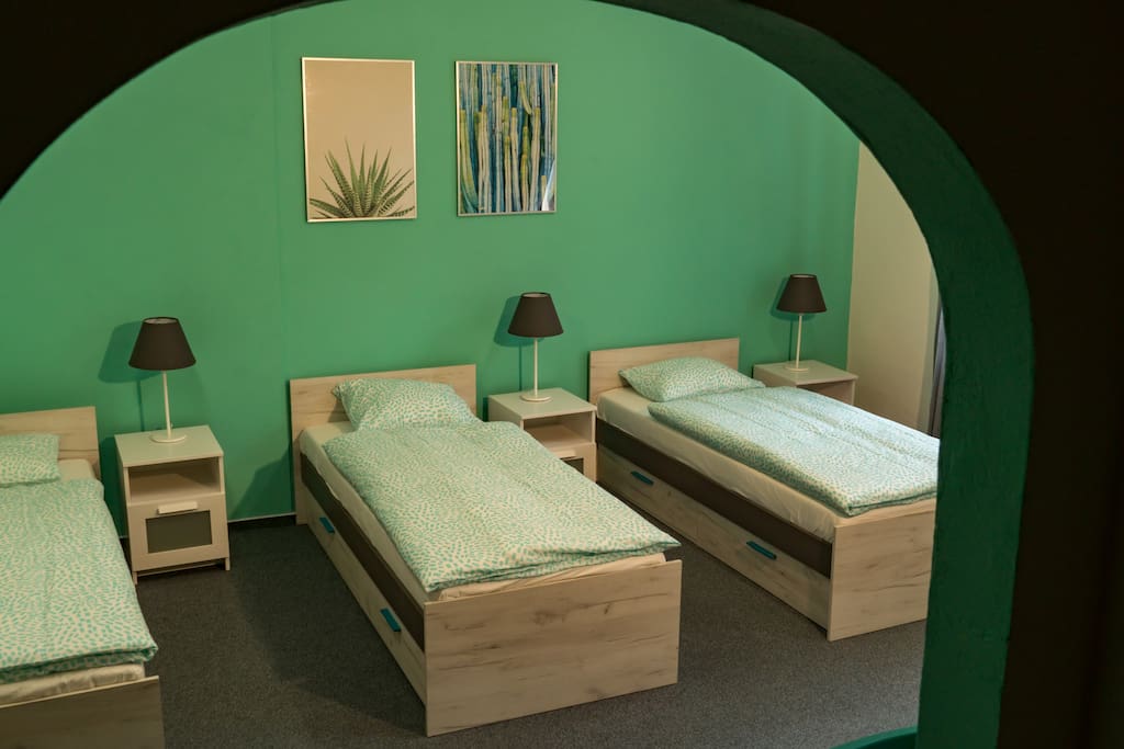 A view of your bedroom with 3 comfortable single beds