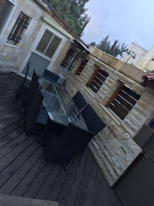 Outdoor dining area next to entrance by the kitchen