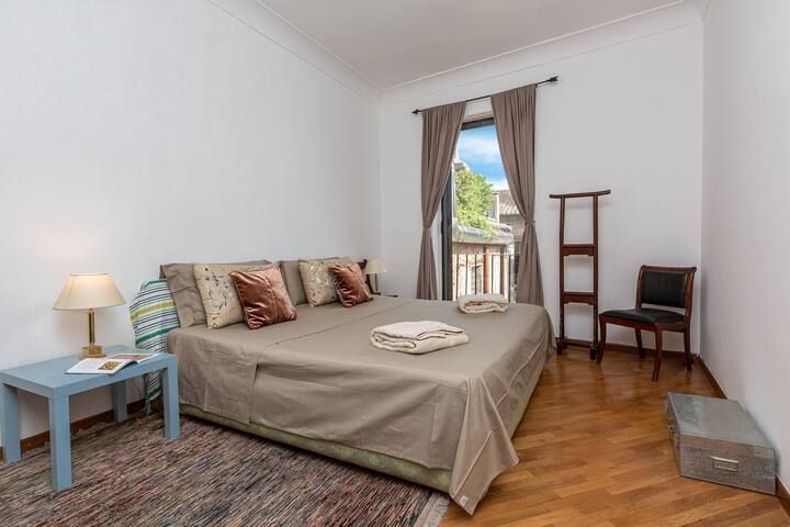 Very bright bedroom with comfortable king size bed with balcony.