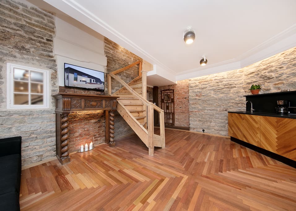 Living room with stairs going to the second floor