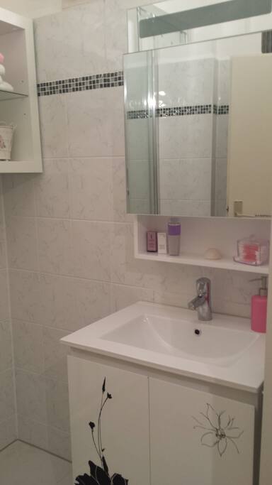 Bathroom. On the left side there is a new washing machine you can use