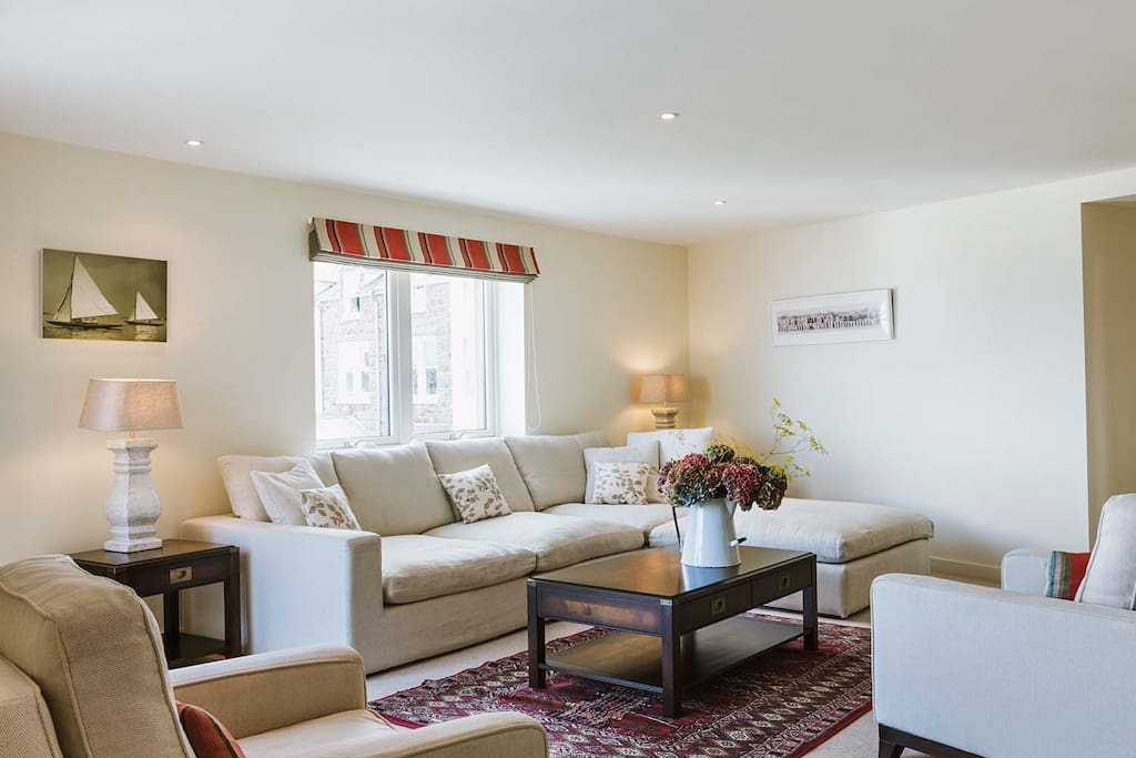 Open plan living room with Apple TV and DVD player