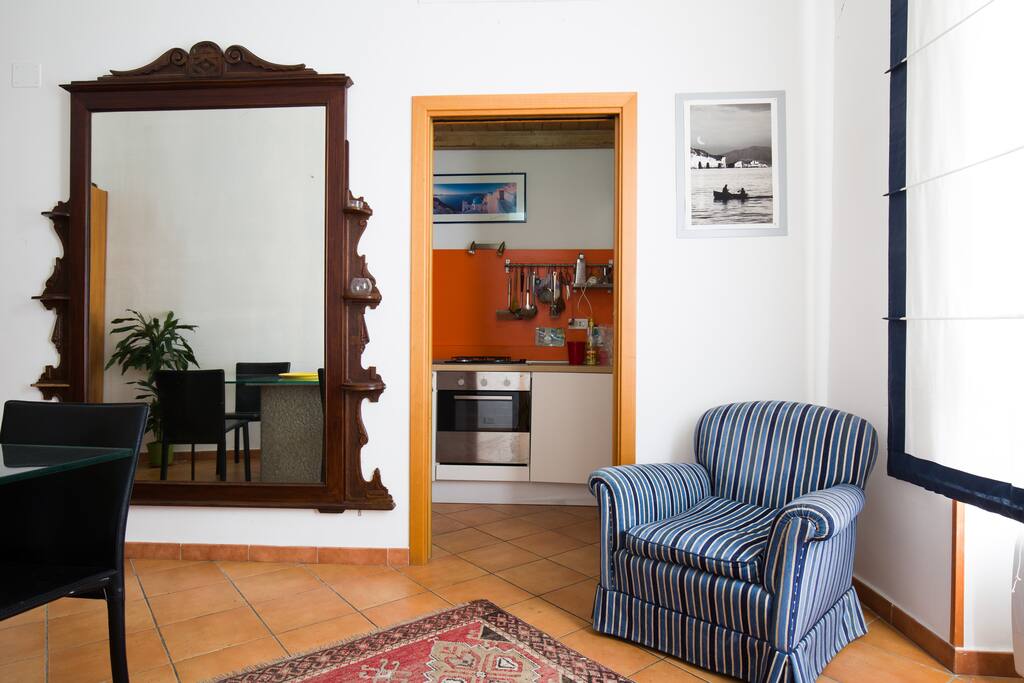 the chair of the dining room and the kitchen entrance
