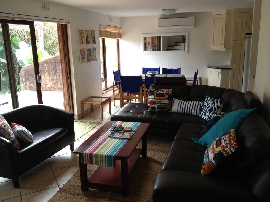 Open plan living and dining room leading onto the patio